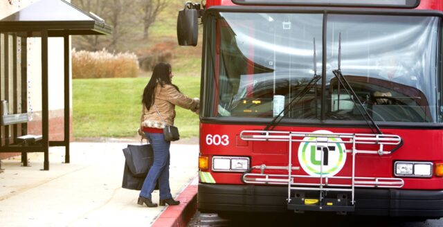 Shopper boards a Lebanon Transit bus at Tanger Outlets Hershey